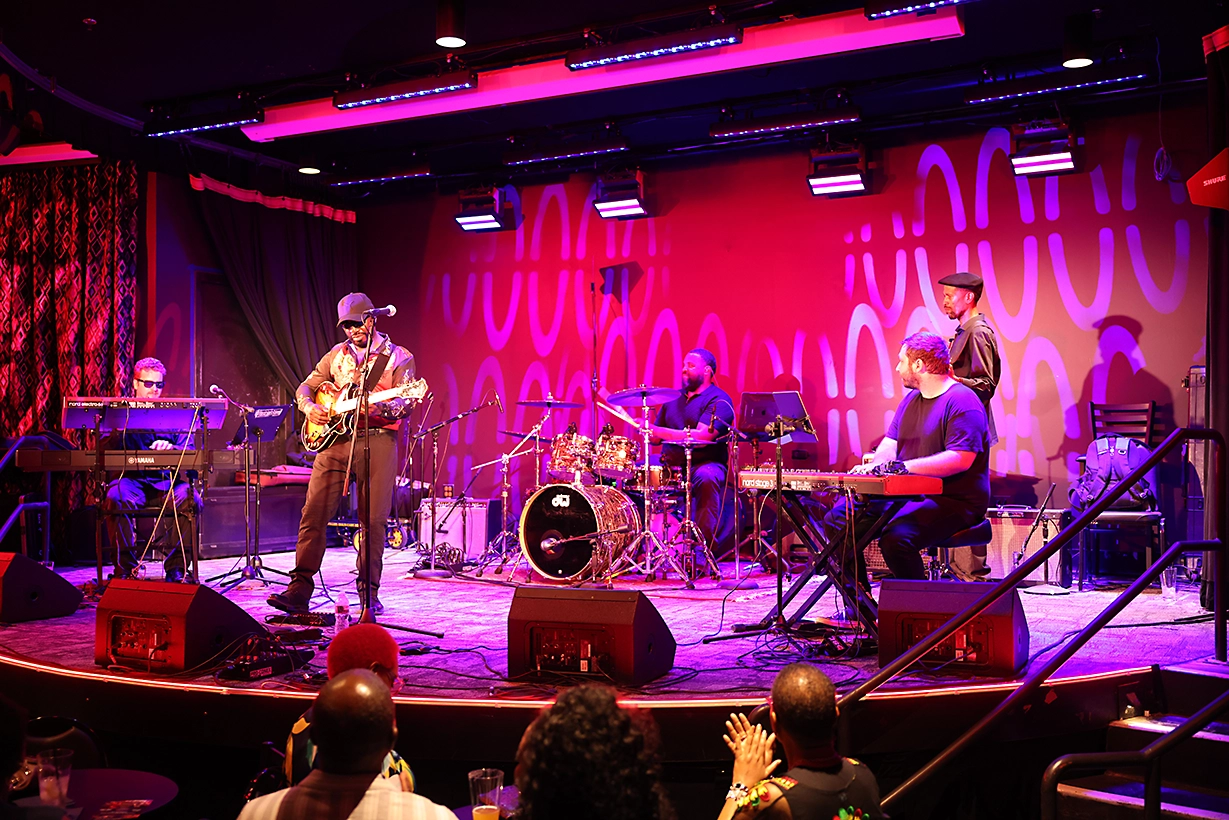 dove underground photo of band playing under bright lights