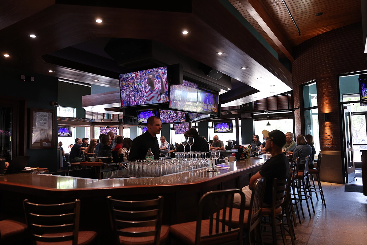 rising phoenix restaurant photo of the bar with world cup on tv